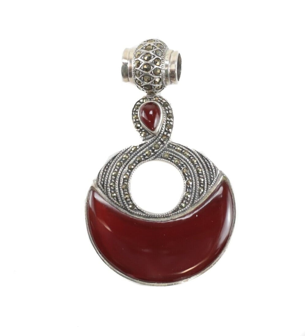 Large Sterling Silver Marcasite Carnelian Pendant: Large Sterling Silver Marcasite Carnelian Pendant - crescent shape and tear drop shaped stones. Marked 925. Measurements: Approx. 16.6grams, Pendant 40mm wide x 50mm; 65mm with bale. Domestic Shipping