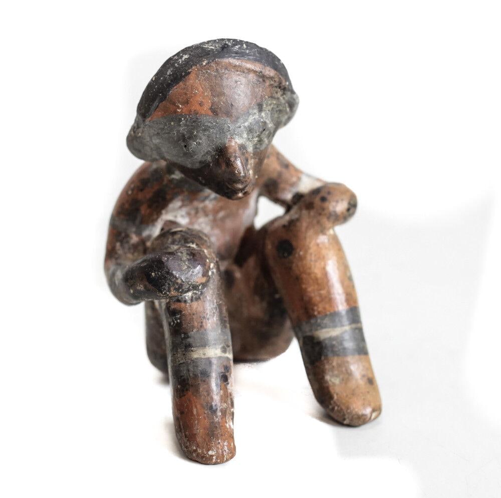 Pre-Columbian NAYARIT Mexico Pottery Small Seated Figure Chinesco Style: Pre-Columbian NAYARIT Mexico Pottery Small Seated Figure, Chinesco Style, Nose ornament, hands on knee. Sex not indicated, most likely male. Black and white slip on redware, mask. Back of head concave