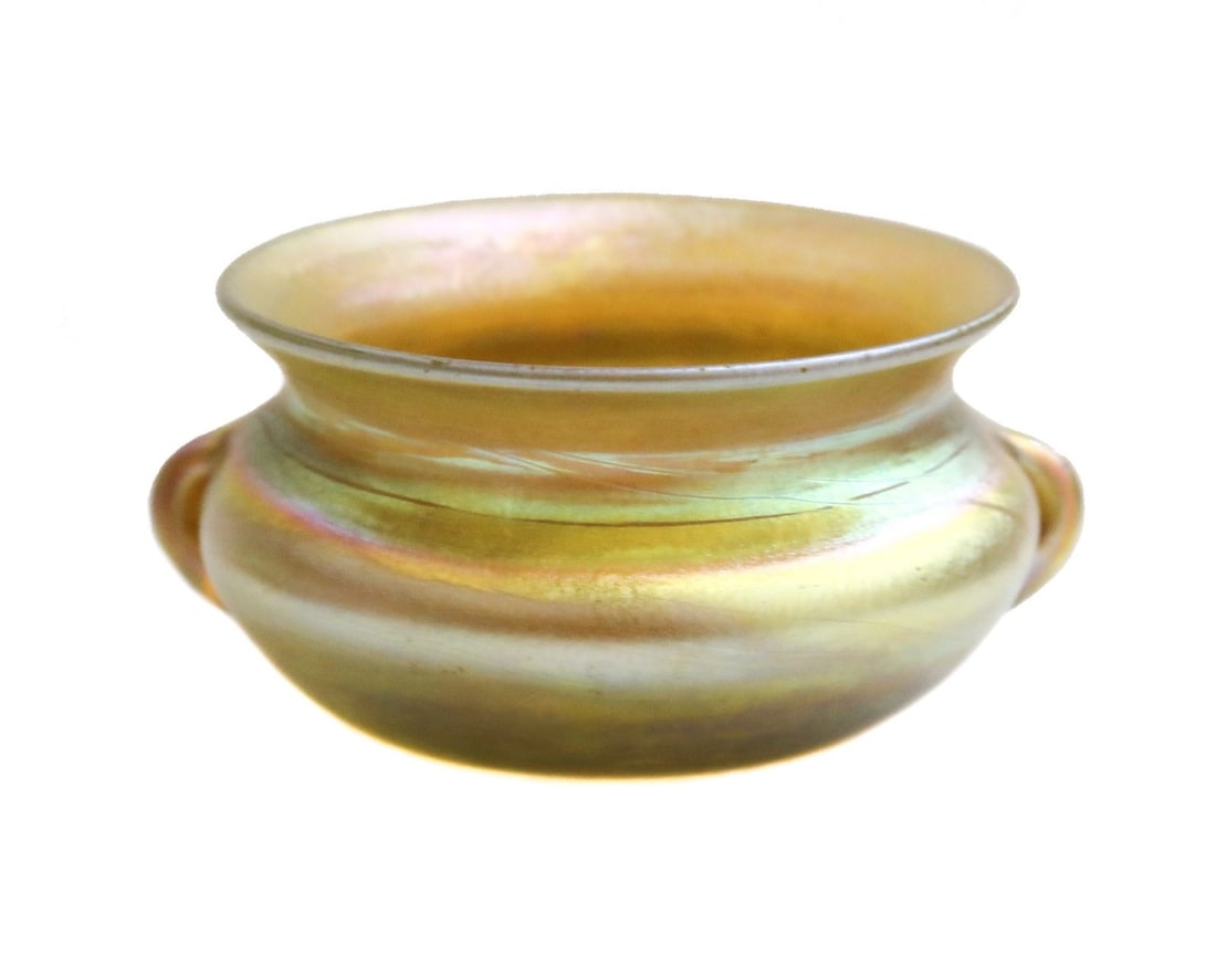 LCT Tiffany Favrile Iridescent Gold Art Glass Twin Handled Bowl Vase 6328 c1900: LCT Tiffany favrile iridescent gold art glass twin handled bowl vase 6328, circa 1900. Signed to underside. Weight: Approx. 1 lb Measurements: Approx. 2.5 inches diameter x 1.125 inches tall Condition