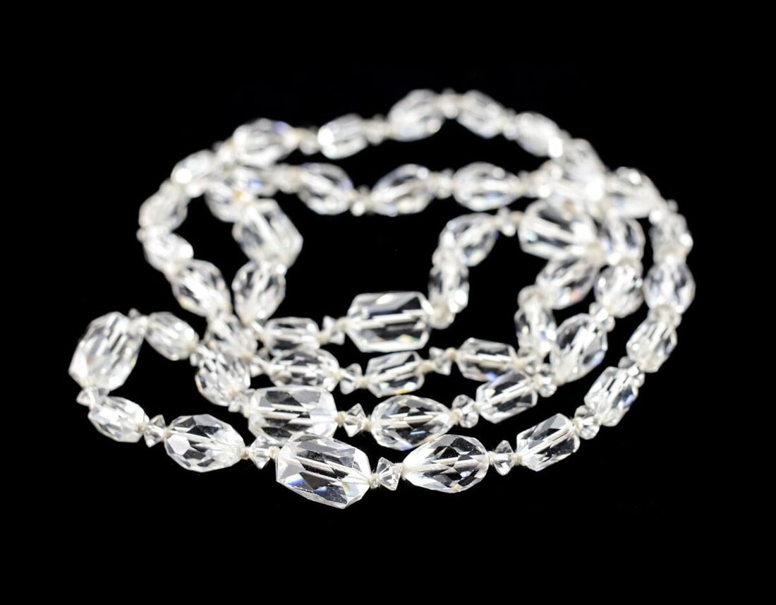 Vintage Hand cut Crystal beaded Necklace teardrop barrel capsule saucer shapes: Vintage Hand cut Crystal beaded Necklace, teardrop, barrel, capsule, saucer shapes, 33inches. Knotted between beads. Measurements: Approx. 16.5inches drop, 33inches total length approx. Largest bead 1