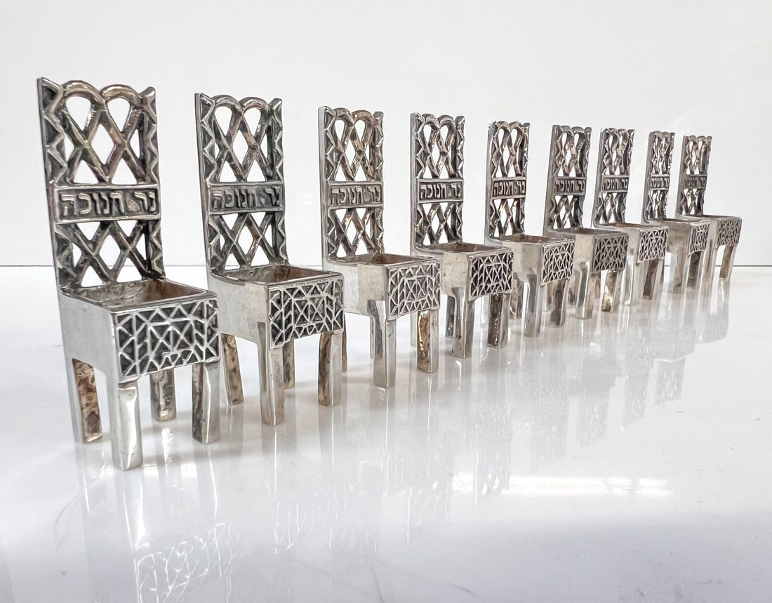 Vintage MMA IM Silverplate Hanukkah 9 Chairs Menorah candle holders: Vintage Museum of Modern Art MMA The Israel Museum Hanukkah 9 Chairs Menorah, Judaica candle holders, each with a well for a candle. With Hebrew calligraphy on the chair backs. Measurements: Approx. e