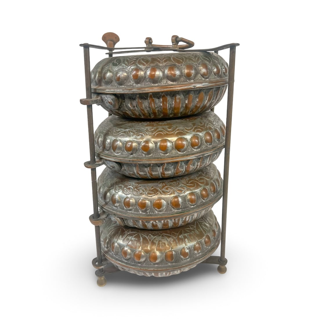 19th-century Ottoman tinned copper multi-tier food box sefertasi: 19th-century Ottoman tinned copper multi-tier food box sefertasi. Four lidded bowls, hand chased foliate and geometric designs. Bronze framework features a cross-bar locking mechanism on top with a sw