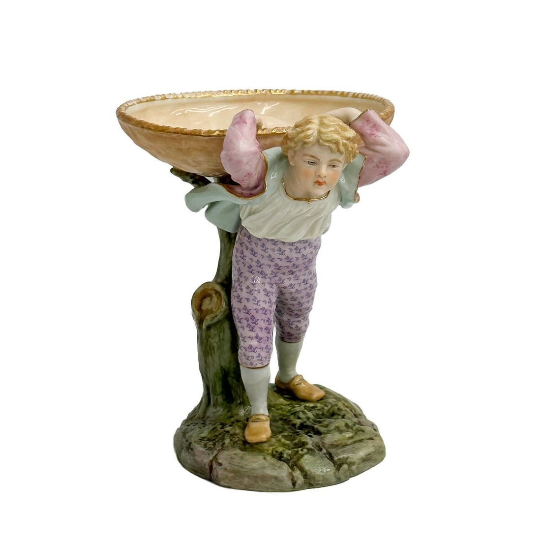 Royal Worcester England Boy with Basket Figural Porcelain Compote 1913: Royal Worcester England Porcelain Boy with Basket Figural Compote. Depicts a boy against a tree trunk supporting a basket. Underside with Royal Worcester marks, date code for 1913. Weight: Approx. 2 l