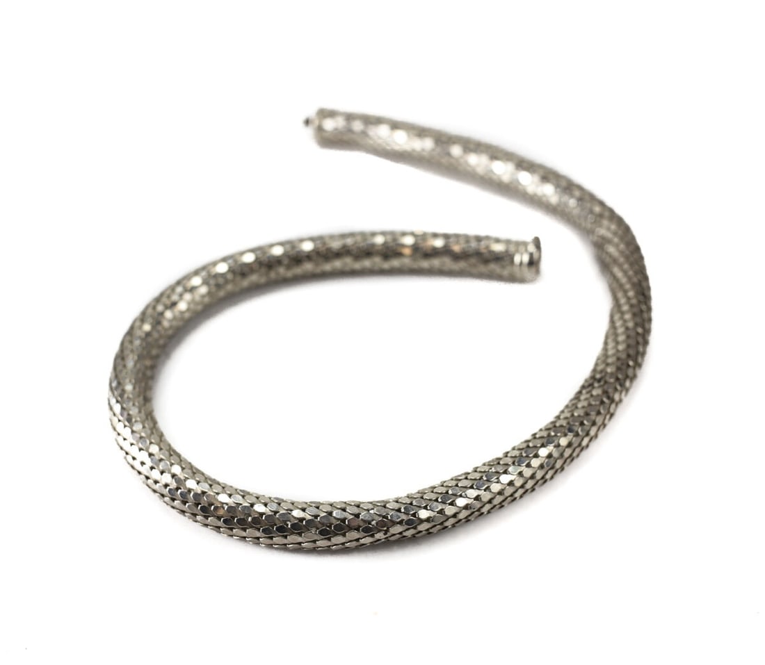 Large Sterling Silver Fish Scale Chain Necklace Choker 16 in length: Large Sterling Silver Fish Scale Chain Necklace Choker 16inches length. Marked 925 Italy. Slightly elastic and stretchable, it is hollow with the scale like links forming a tube. 42.5grams Measurement