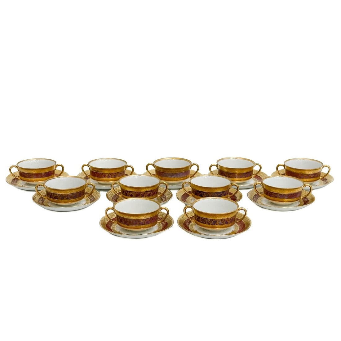 11 D&B German Gilt Porcelain Bouillon Cups & Underplates Red: 11 German Gilt Porcelain Bouillon Cups & Underplates Red. A red band to the edge, gilt floral decoration to the edge. Underside of saucers marked D&B germany, cups unmarked Weight Approx. 4.5 lbs Meas