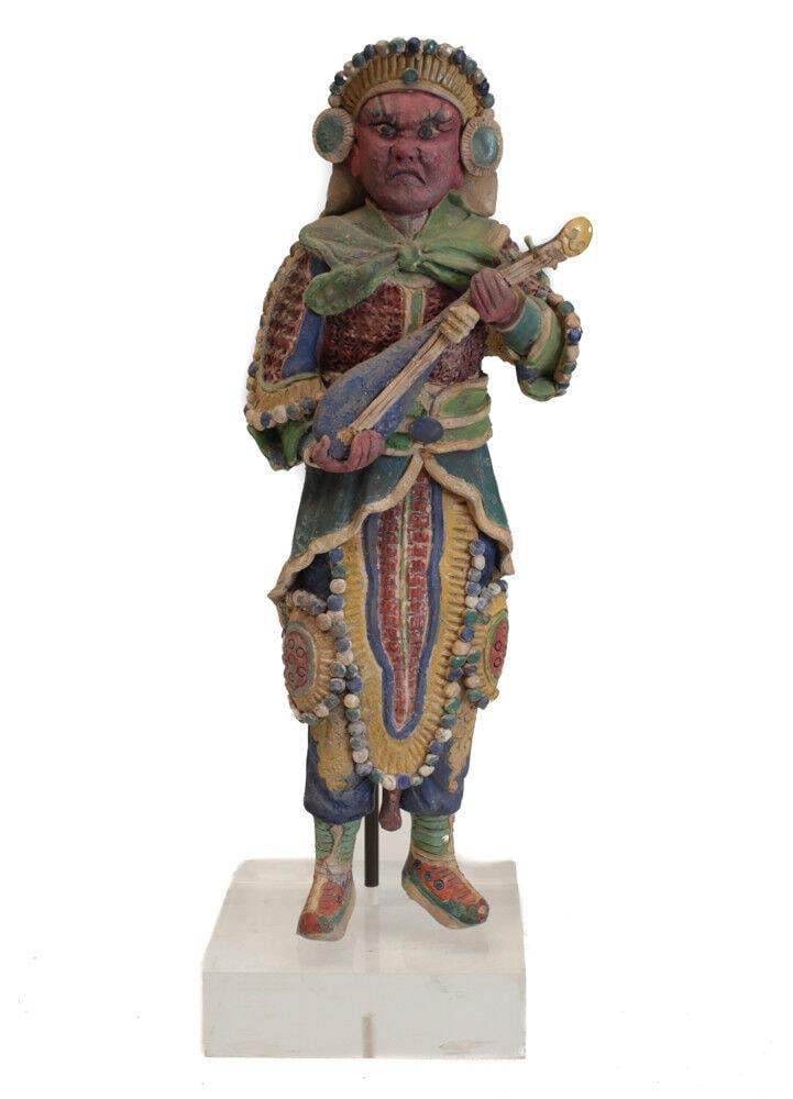 19th century Chinese Polychrome Stucco Roof Figure Warrior with mandolin: 19th century Chinese Polychrome Stucco Figure, Warrior with mandolin, Superb details, red face, fierce countenance. On metal and acrylic mount. 6.lbs Measurements: Approx. 14.25" height without base. 