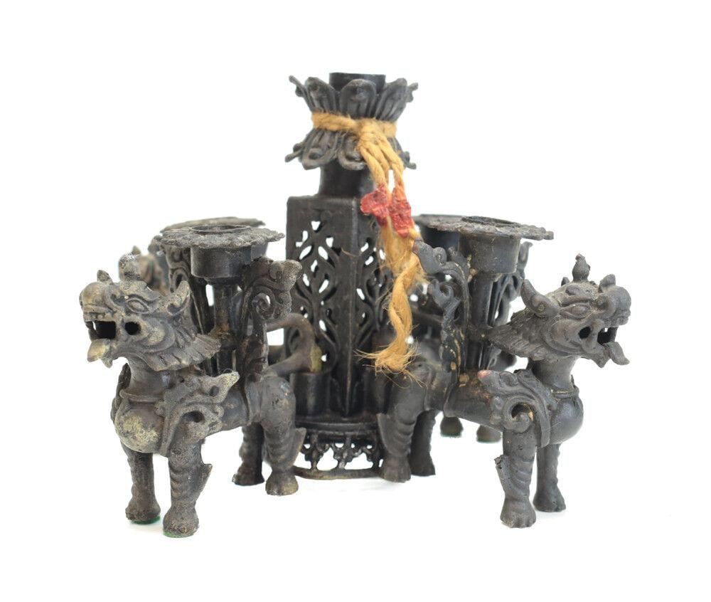 Chinese Bronze Pixiu Kylin Candelabra / Candle holders jointed: Chinese Bronze Pixiu Kylin Candelabra / Candle holders, jointed, the figures are removable. 5 branches. Remnant of rope and wax seal. 3Lbs Measurements: Approx. 6" height x 9" Condition: Good conditio
