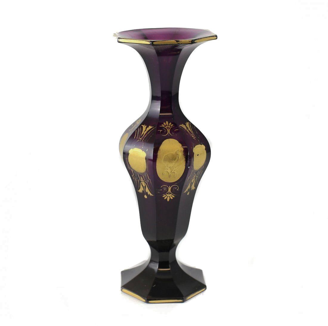 Bohemian Amethyst Cut Glass Vase c1900 Hand Painted Gilt Birds music instruments: Bohemian Amethyst Cut Glass Vase, c1900. An early 20th century Bohemian deep amethyst color, cut glass vase with hand painted raised gilt depicting birds, instruments and flowers; interspersed with ma