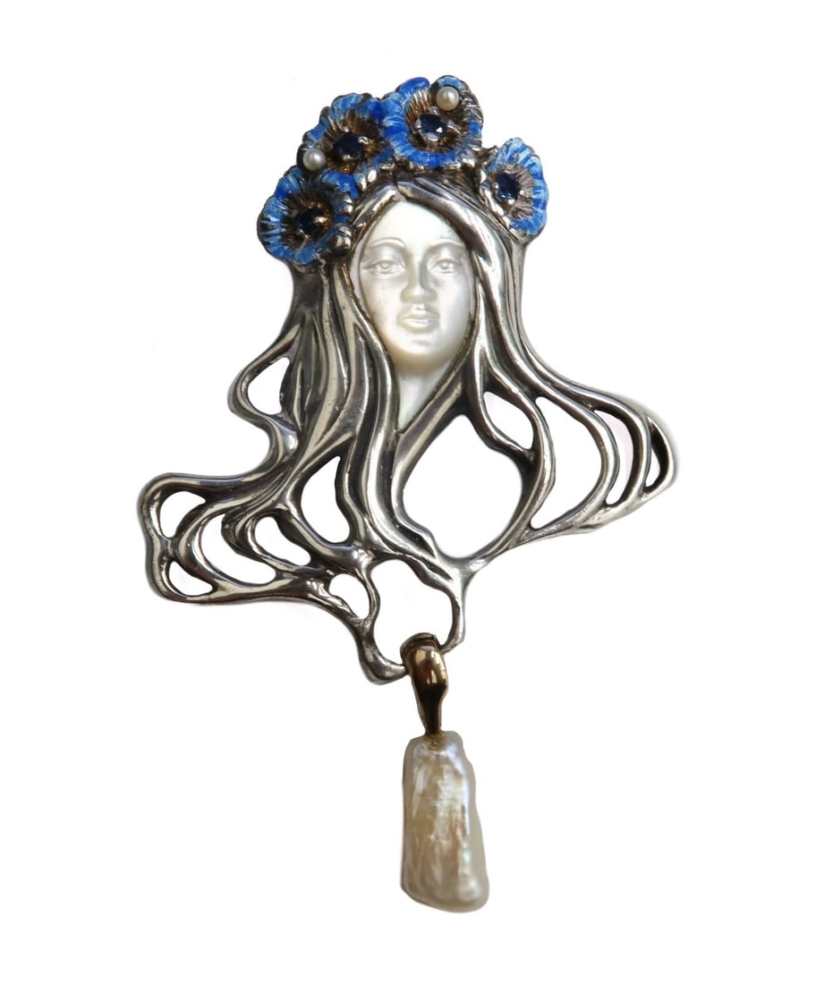 Douglas Hofmann CFA MoP 14k Gold Sterling Silver Sapphire Art Nouveau Brooch: Douglas Hofmann CFA MoP 14k gold sterling silver and sapphire brooch, circa 1970. The Art Nouveau style pendant depicts a beauty that is carved from Mother of Pearl with sterling silver hair adored wi