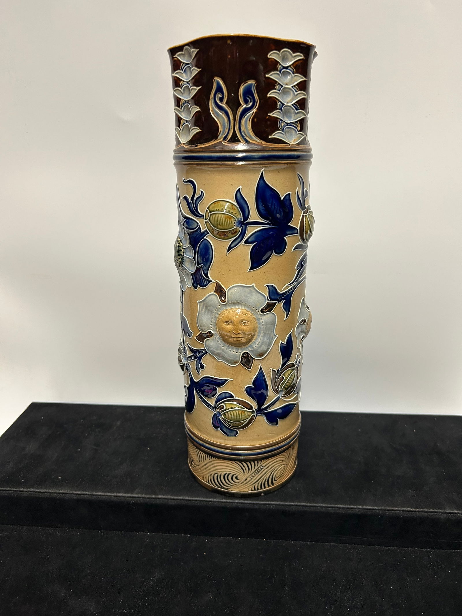 Early 20th Century Royal Doulton Art Nouveau Stoneware Beer Stein with Floral Relief: This beautifully modeled beer stein was produced by Royal Doulton during the height of the Art Nouveau movement, circa 1900–1910. Crafted in fine stoneware, the vessel displays an elegant relief of