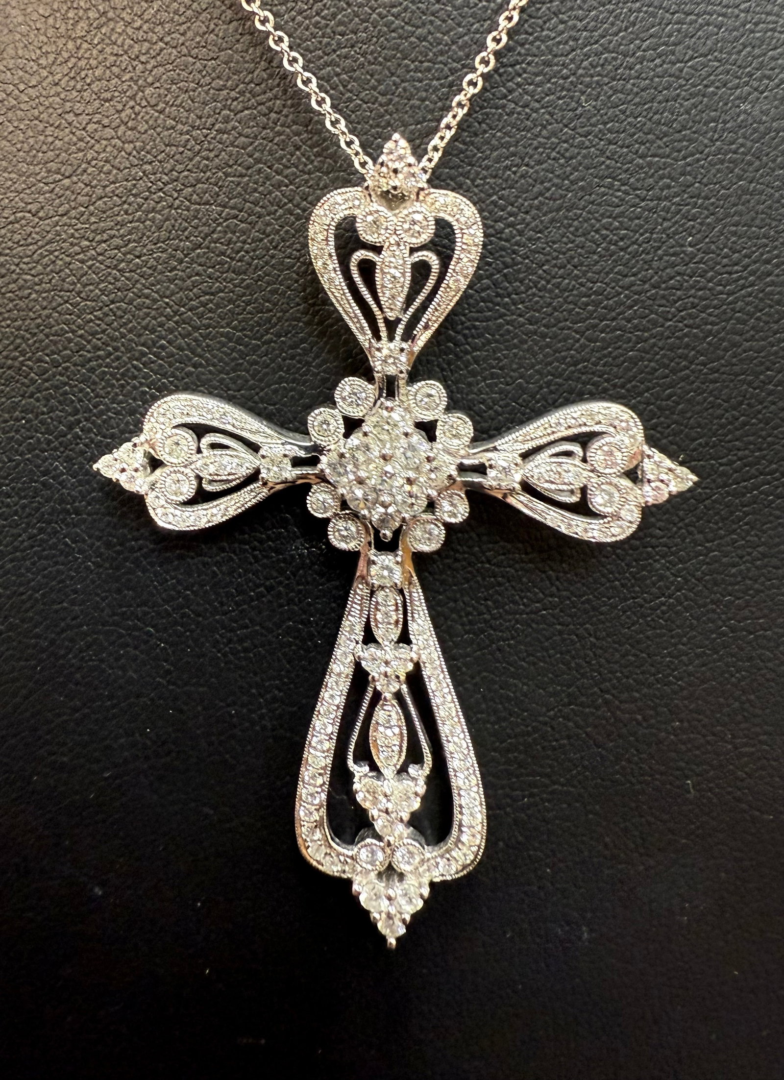 Beautifully Crafted Diamond Filigree Cross Necklace: This elegant 14K white gold diamond cross pendant captures timeless craftsmanship with an intricate openwork filigree design. Each curve and scroll is thoughtfully detailed, forming a graceful silhoue