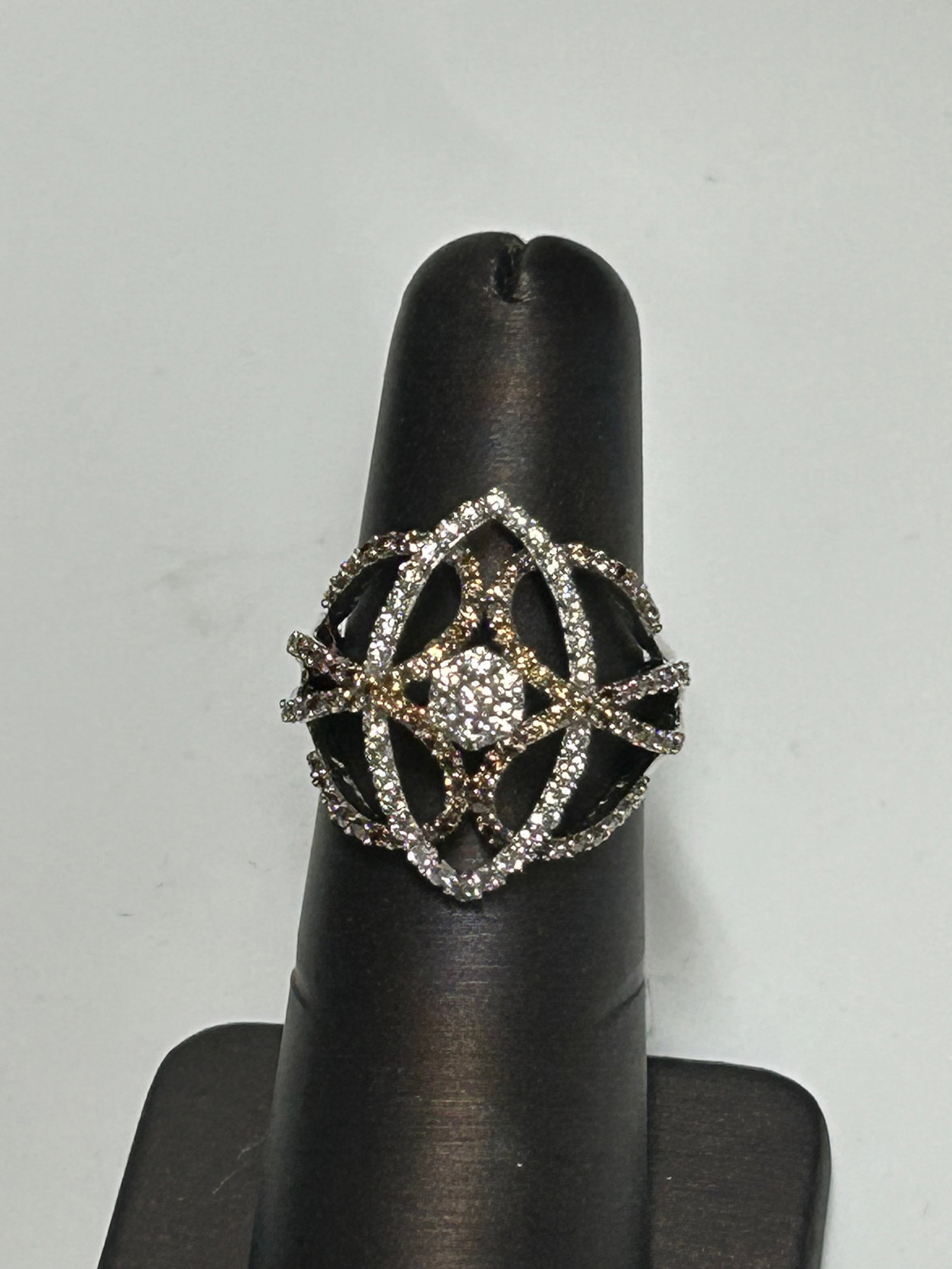 Champagne and White Diamond Ring, Size 6: An exquisite creation of light and geometry, this Celestial Lattice ring is crafted in 14K white gold and features a mesmerizing pattern of interwoven arcs and angles. At its center, clusters of champ