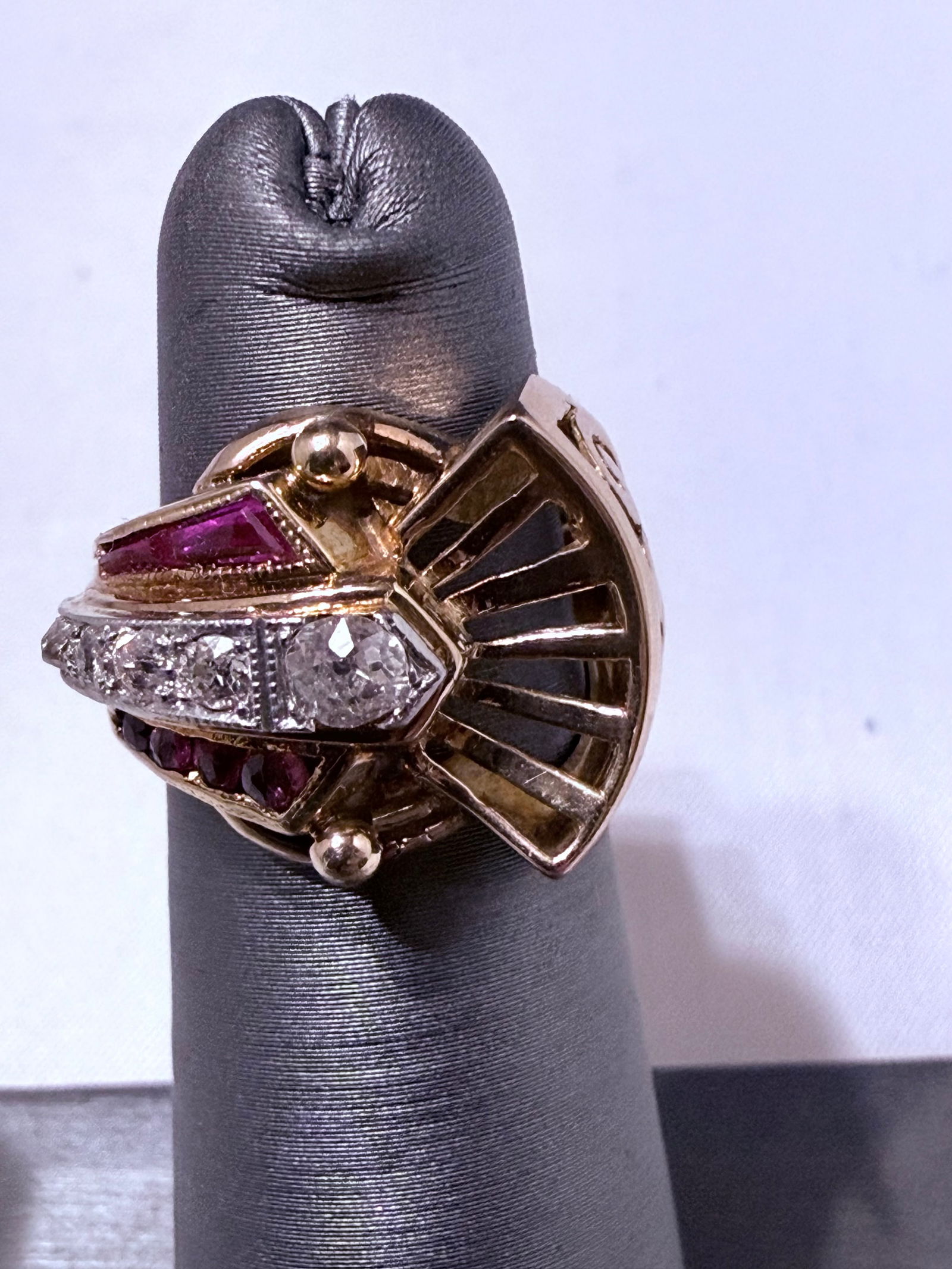 14K Yellow Gold “Scarlet Fan” Ruby & Diamond Ring Size 6.5: This striking 14K yellow gold ring captures the bold geometry and sculptural elegance of mid-century design. The piece features a dramatic fan-like motif accented by vivid ruby inlays and a shimmering