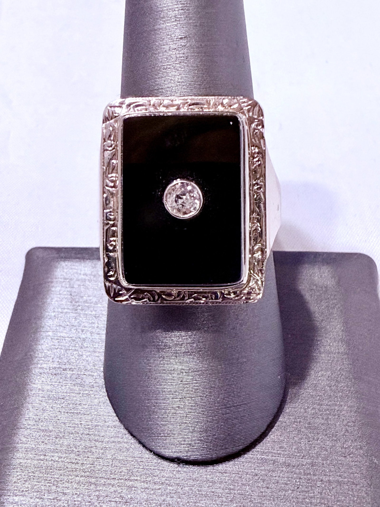 Antique Black Onyx with Diamond Ring Size 9: Striking in contrast and sophistication, this vintage 10K yellow gold ring features a polished rectangular black onyx tablet framed in ornate engraved gold. At its center rests a brilliant round diamo
