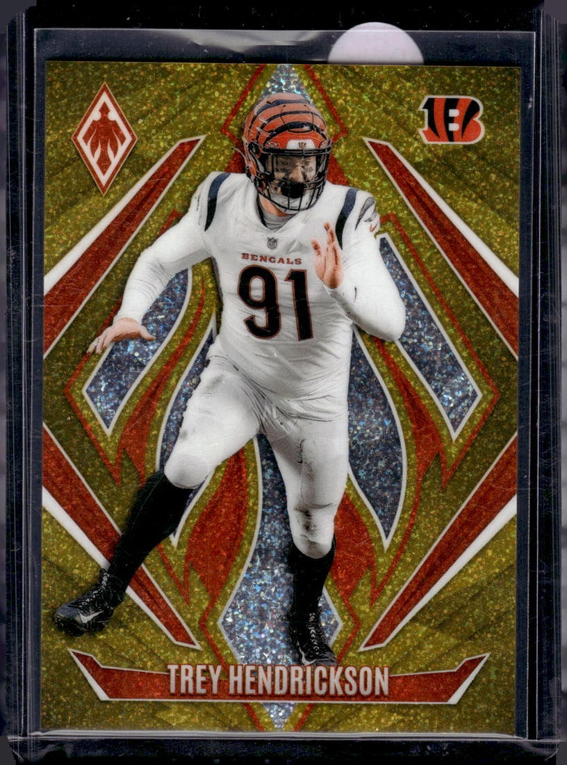 Trey Hendrickson Gold International /10 2024 Panini Phoenix #138 Bengals Football Card: Panini Select, Prizm, Mosaic, Contenders, Zenith, Phoenix, Illusions, Absolute, Rookie NFL Sports Trading Cards, SP, SSP, Cards, Football Cards for Sale Near Me, Superbowl & Hall of Fame Player Cards,