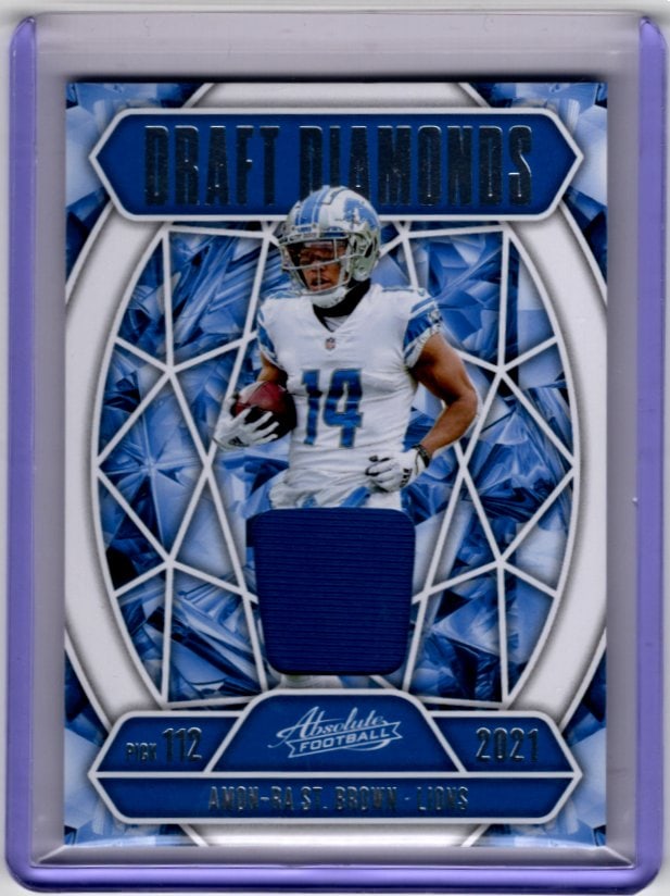 Amon-Ra St. Brown Patch 2025 Absolute #DDJ-ASB Detroit Lions: Panini Select, Prizm, Mosaic, Contenders, Zenith, Phoenix, Illusions, Absolute, Rookie NFL Sports Trading Cards, SP, SSP, Cards, Football Cards for Sale Near Me, Superbowl & Hall of Fame Player Cards,