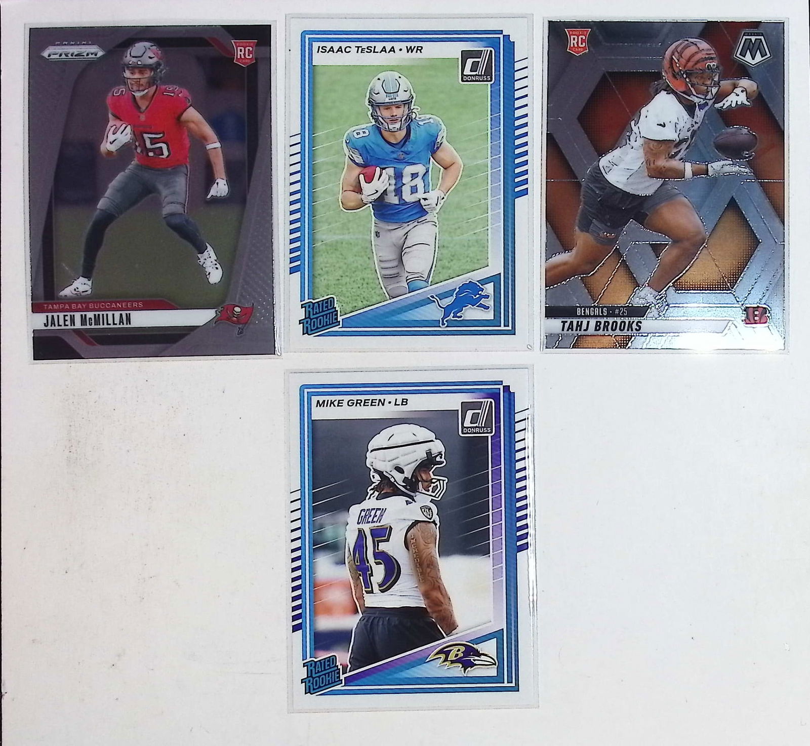 Rookie Football Cards of Panini: Jalen McMillan, Isaac Teslaa, Tahj Felton, Mike Green (1 of 2)