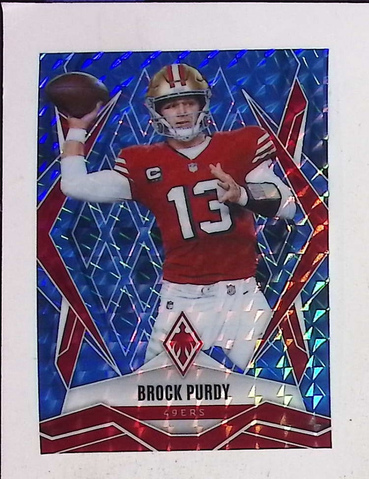 Brock Purdy 12/389 Light Blue Pyramids 2025 Panini Phoenix #33 San Francisco 49ers (1 of 2)