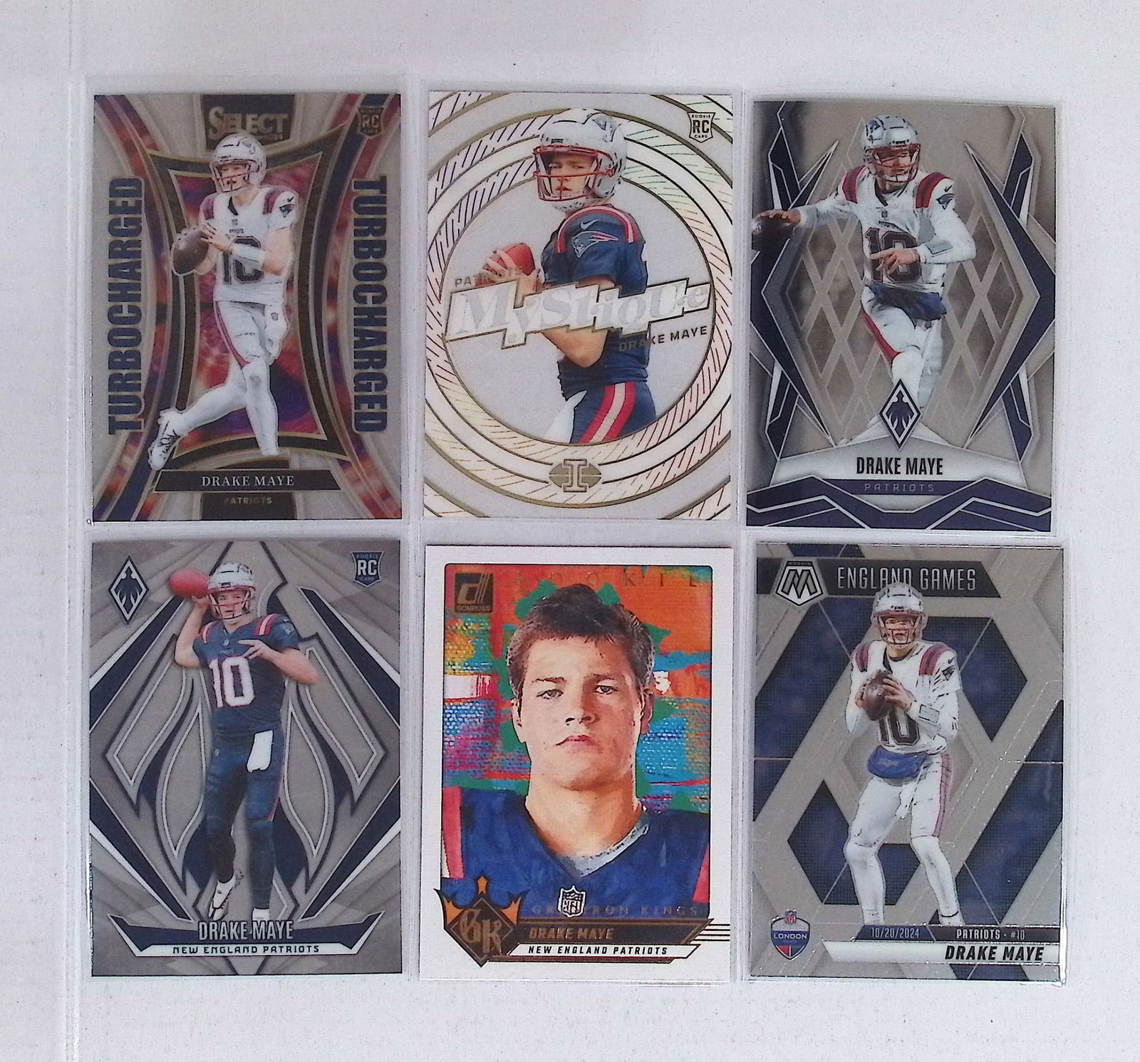 Drake Maye 4 Rookie Cards & 2 Second Year Cards Turbocharged, Acetate Mystique, Diamond Kings: Panini Select, Prizm, Mosaic, Contenders, Zenith, Phoenix, Illusions, Absolute, Rookie NFL Sports Trading Cards, SP, SSP, Cards, Football Cards for Sale Near Me, Superbowl & Hall of Fame Player Cards,