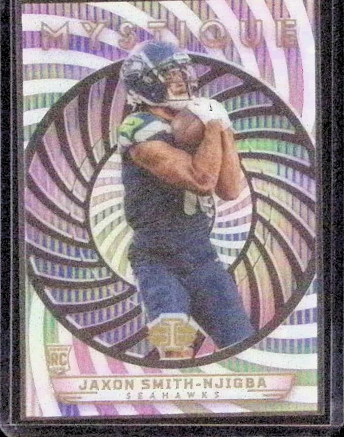 Jaxon Smith-Njigba Rookie Card Acetate Mystique Insert 2023 Panini Illusions #17: Panini Select, Prizm, Mosaic, Contenders, Zenith, Phoenix, Illusions, Absolute, Rookie NFL Sports Trading Cards, SP, SSP, Cards, Football Cards for Sale Near Me, Superbowl & Hall of Fame Player Cards,