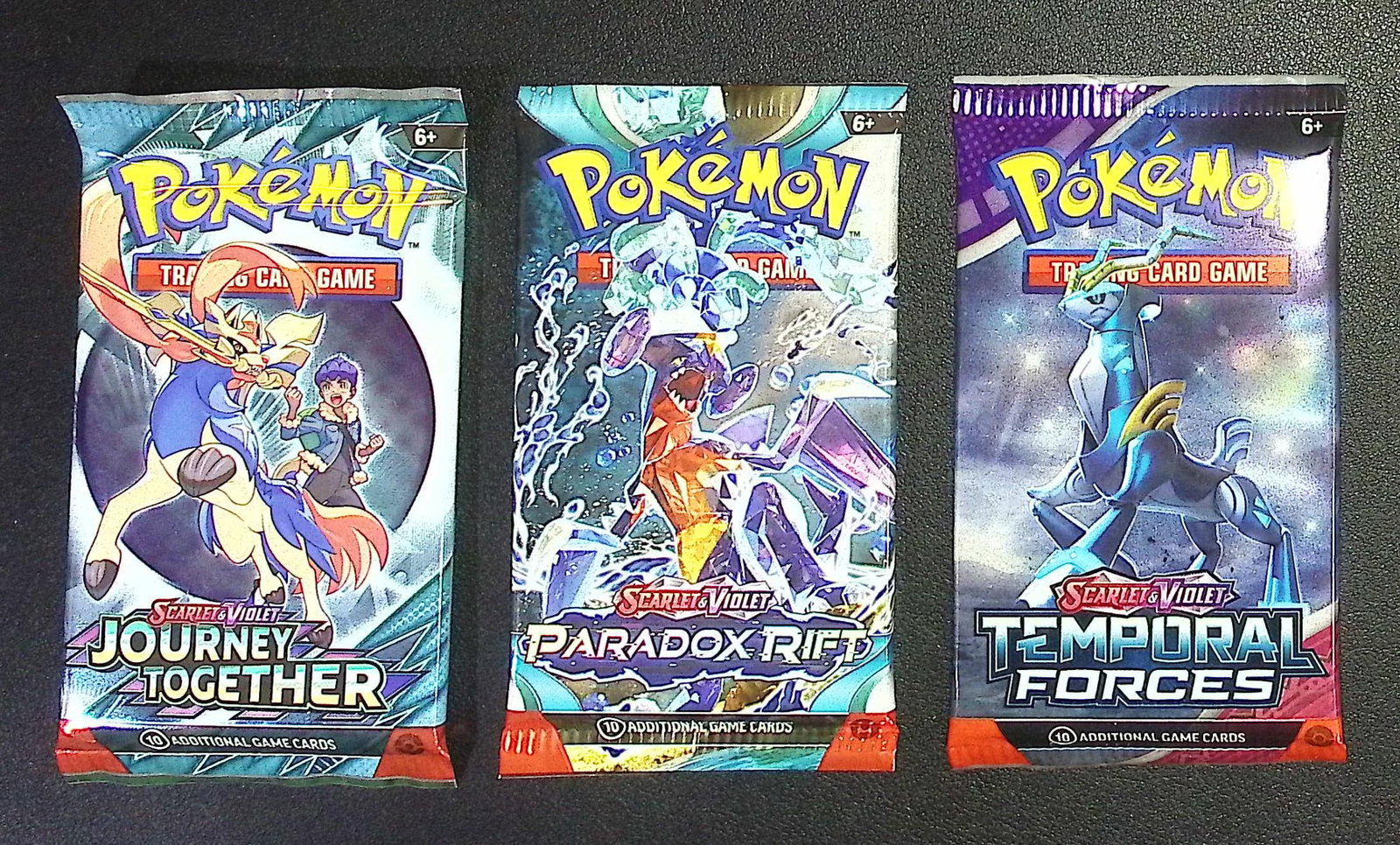 3 COUNT: 1 - Pokemon Journey Together, 1 - Paradox Rift, & 1 - Temporal Forces Booster Packs: Pokemon Trading Card Game Cards, Charizard, Pikachu, Mewto, EX, Referse Holo, Holo Rare Cards, Secret Rare Cards, Full Art Cards, Evee, 3 Stars Ultra Rare Cards, Double Rare, Illustration Rare, Specia