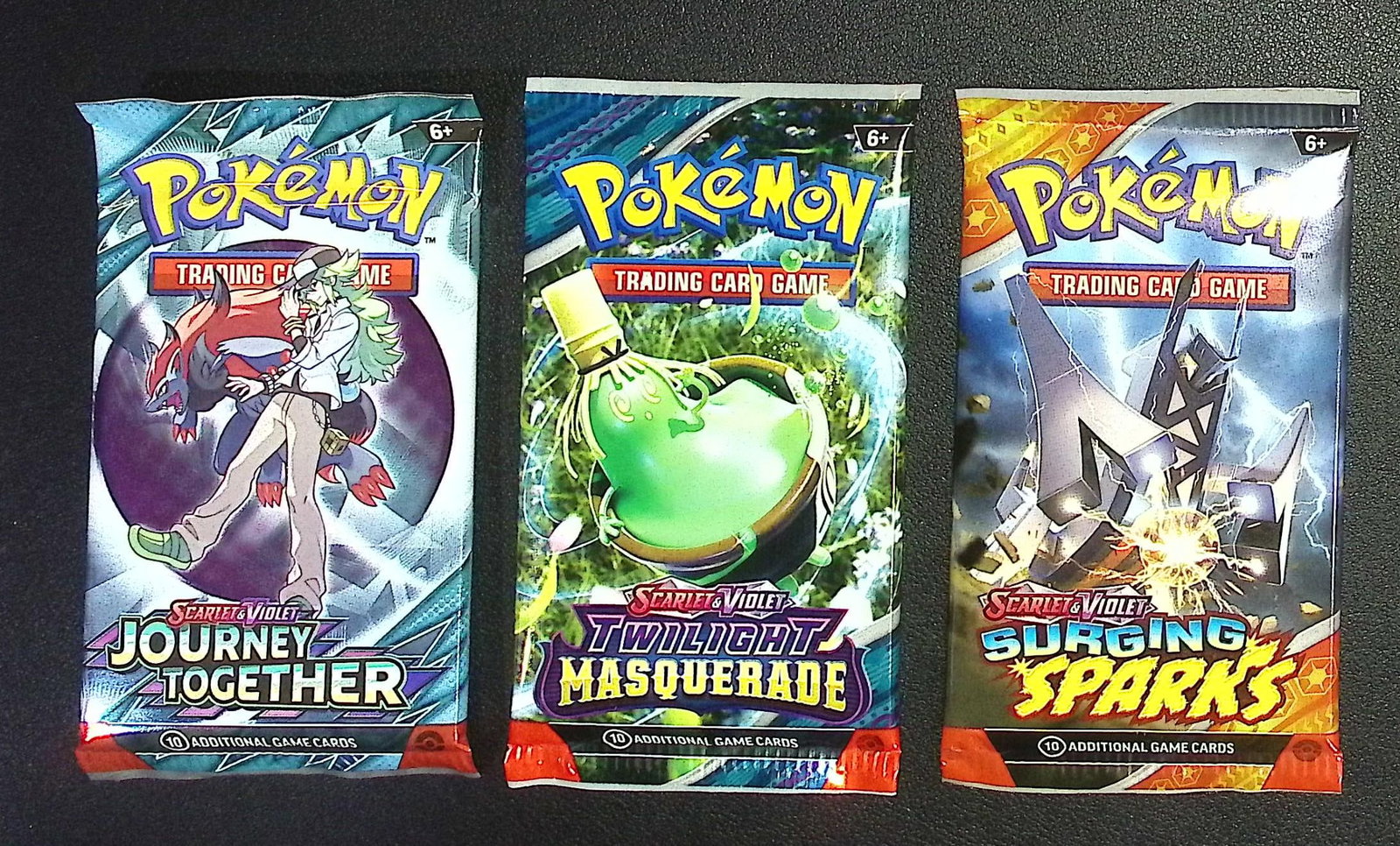 3 COUNT: 1 - Pokemon Journey Together, 1 - Surging Sparks, 1 - Twilight Masquerade Booster Packs: Pokemon Trading Card Game Cards, Charizard, Pikachu, Mewto, EX, Referse Holo, Holo Rare Cards, Secret Rare Cards, Full Art Cards, Evee, 3 Stars Ultra Rare Cards, Double Rare, Illustration Rare, Specia