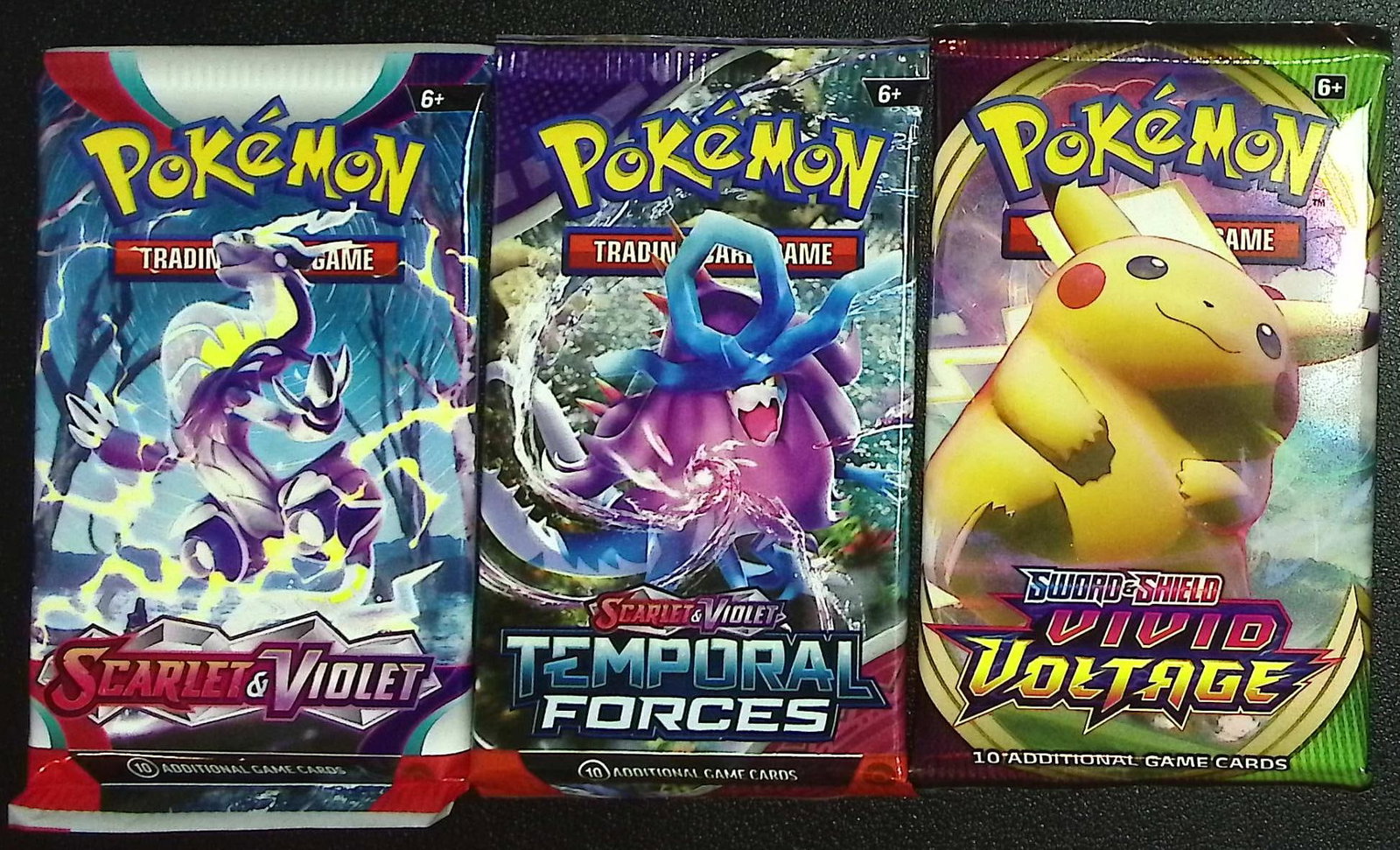 3 COUNT: 1 - Pokemon Scarlet & Violet, 1 - Temporal Forces, & 1 - Vivid Voltage Booster Packs: Pokemon Trading Card Game Cards, Charizard, Pikachu, Mewto, EX, Referse Holo, Holo Rare Cards, Secret Rare Cards, Full Art Cards, Evee, 3 Stars Ultra Rare Cards, Double Rare, Illustration Rare, Specia