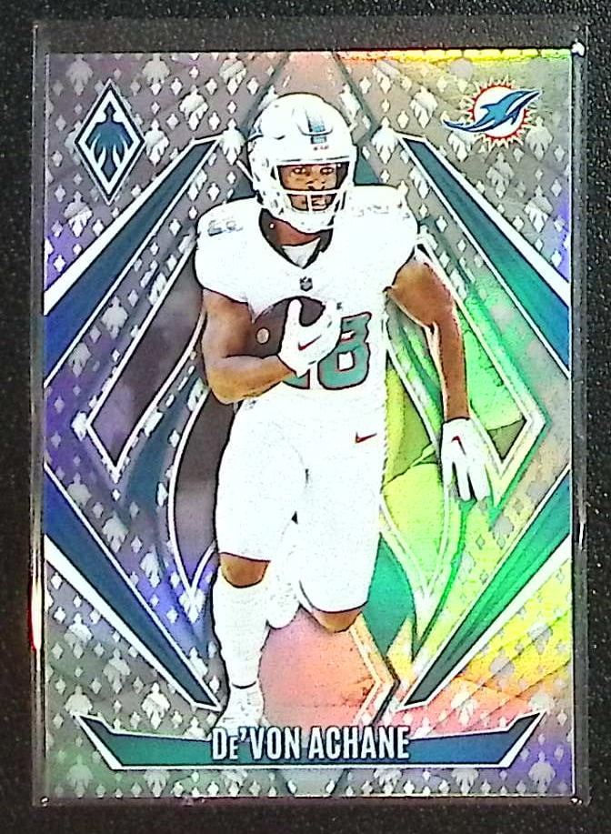 De'Von Achane Phoenix Logo /399 2024 Panini Phoenix #47 Miami Dolpins: Panini Select, Prizm, Mosaic, Contenders, Zenith, Phoenix, Illusions, Absolute, Rookie NFL Sports Trading Cards, SP, SSP, Cards, Football Cards for Sale Near Me, Superbowl & Hall of Fame Player