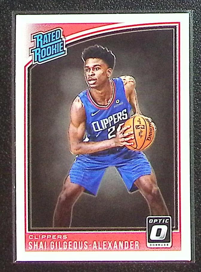 Shai Gilgeous-Alexander Rookie Card 2018-19 Donruss Optic #162 Clippers, Thunder: Panini Select, Prizm, Mosaic, Contenders, Revolution, Phoenix, NBA Hoops, Rookie NFL Sports Trading Cards, Silver, SP, SSP, Wave Prizms, Numbered Cards, Basketball sports Cards for Sale Near Me, NBA C