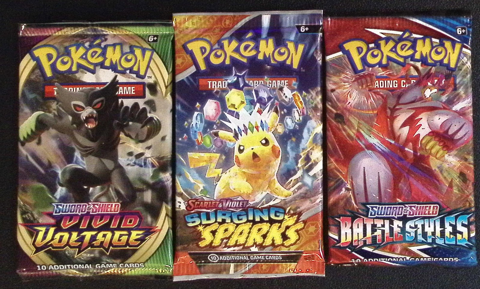 3 COUNT: 1 - Pokemon Battle Styles, 1 - Surging Sparks, & 1 - Vivid Voltage Booster Packs: Pokemon Trading Card Game Cards, Charizard, Pikachu, Mewto, EX, Referse Holo, Holo Rare Cards, Secret Rare Cards, Full Art Cards, Evee, 3 Stars Ultra Rare Cards, Double Rare, Illustration Rare, Specia