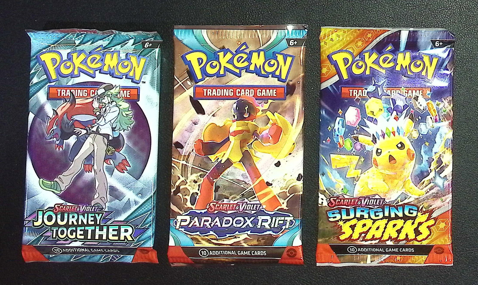 3 COUNT: 1 - Pokemon Journey Together, 1 - Paradox Rift, & 1 - Surging Sparks Booster Packs (1 of 1)