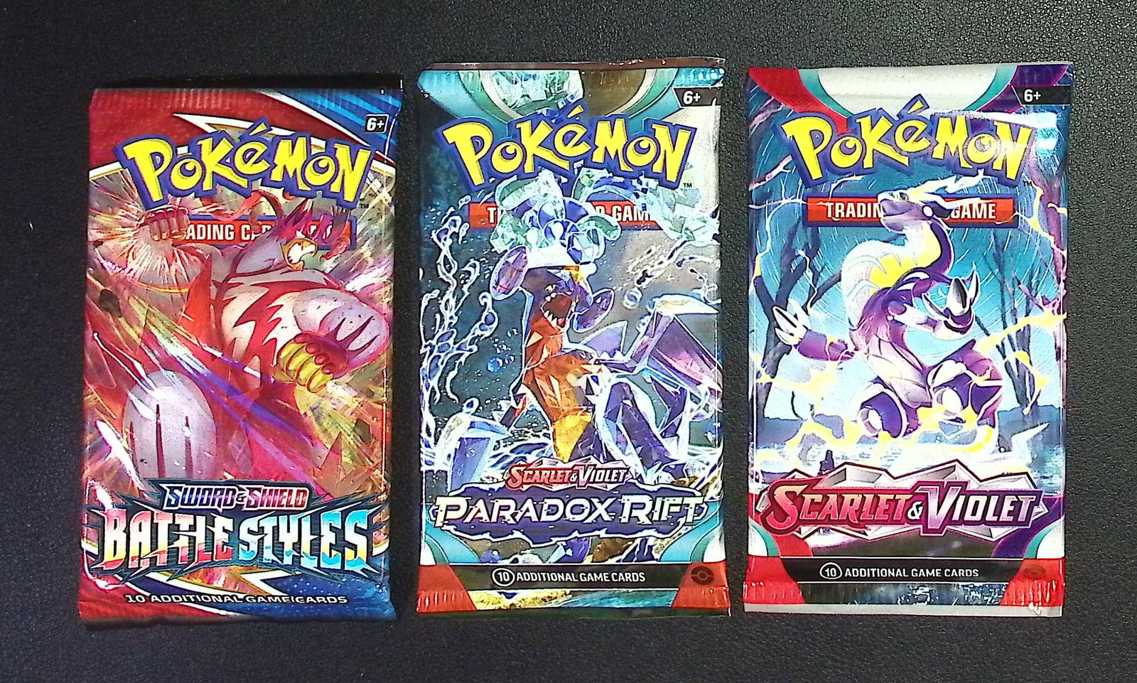 3 COUNT: 1 - Pokemon Battle Styles, 1 - Paradox Rift, & 1 - Scarlet & Violet Booster Packs: Pokemon Trading Card Game Cards, Charizard, Pikachu, Mewto, EX, Referse Holo, Holo Rare Cards, Secret Rare Cards, Full Art Cards, Evee, 3 Stars Ultra Rare Cards, Double Rare, Illustration Rare, Specia