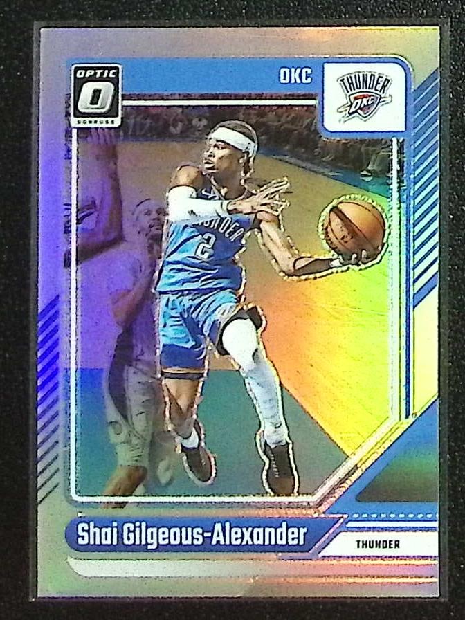 Shai Gilgeous-Alexander Holo Prizm 2024-25 Donruss Optic #127 OKC Thunder: Panini Select, Prizm, Mosaic, Contenders, Revolution, Phoenix, NBA Hoops, Rookie NFL Sports Trading Cards, Silver, SP, SSP, Wave Prizms, Numbered Cards, Basketball sports Cards for Sale Near Me, NBA C