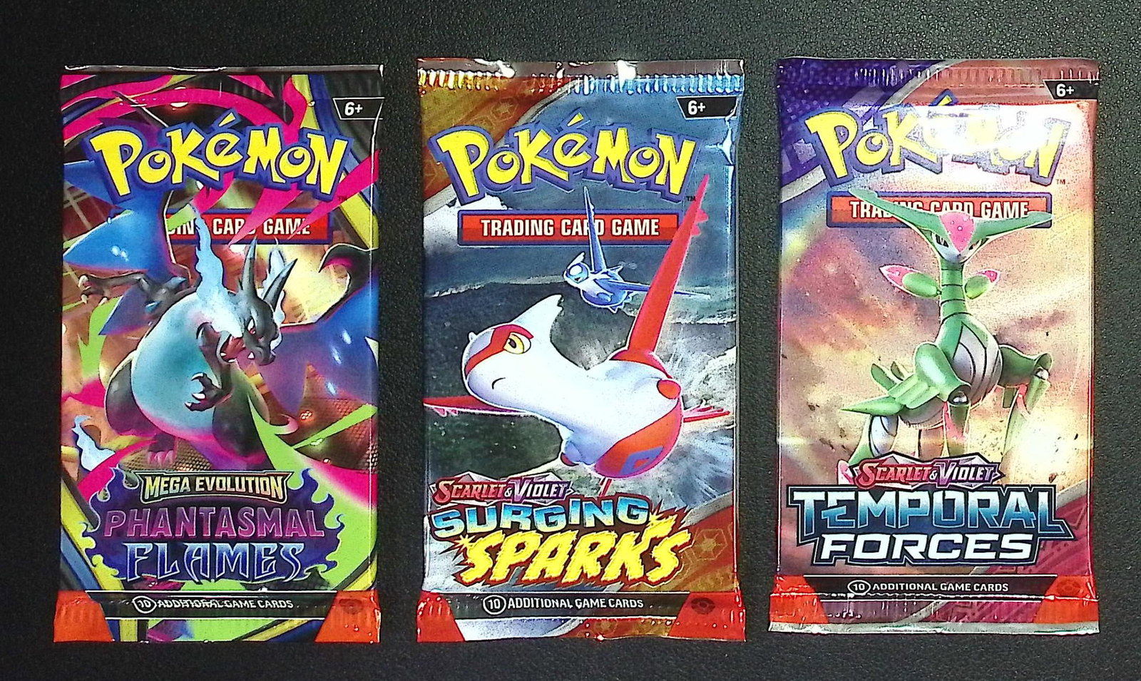 3 COUNT: 1 - Pokemon Phantasmal Flames, 1 -Surging Sparks, & 1 - Temporal Forces Booster Packs: Pokemon Trading Card Game Cards, Charizard, Pikachu, Mewto, EX, Referse Holo, Holo Rare Cards, Secret Rare Cards, Full Art Cards, Evee, 3 Stars Ultra Rare Cards, Double Rare, Illustration Rare, Specia