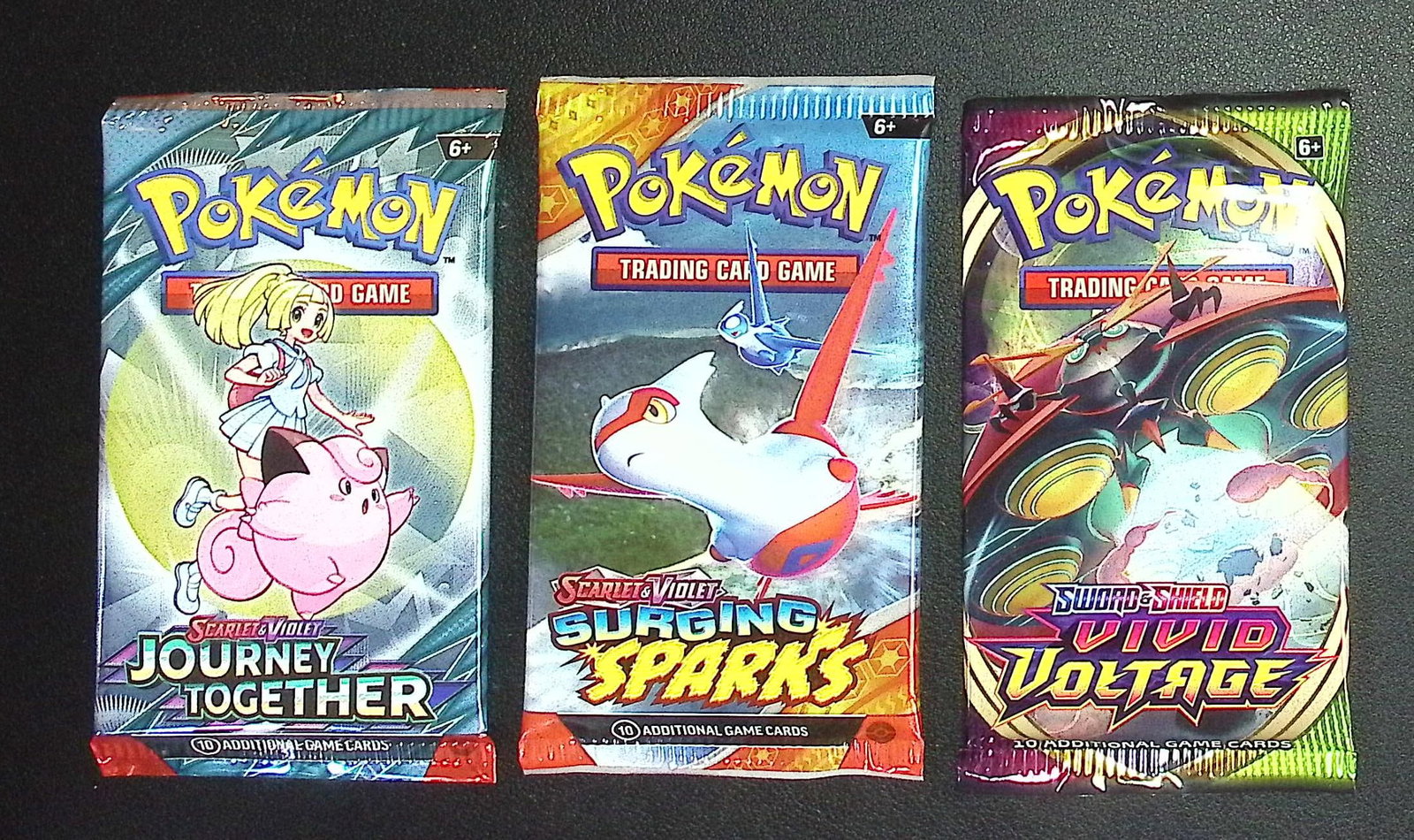 3 COUNT: 1 - Pokemon Journey Together, 1 - Surging Sparks, 1 - Vivid Voltage Booster Packs (1 of 1)