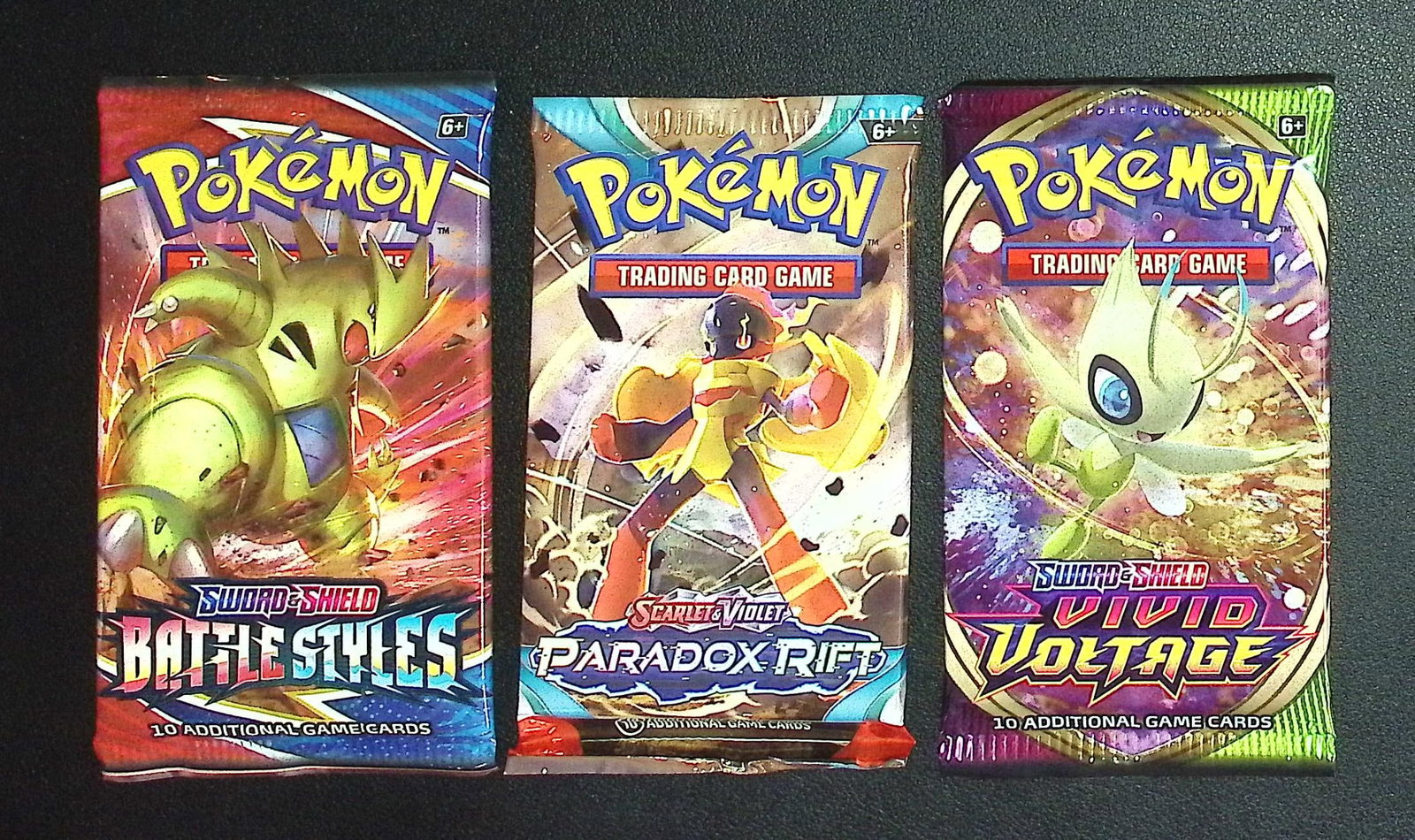 3 COUNT: 1 - Pokemon Battle Styles, 1 - Paradox Rift, & 1 - Vivid Voltage Booster Packs: Pokemon Trading Card Game Cards, Charizard, Pikachu, Mewto, EX, Referse Holo, Holo Rare Cards, Secret Rare Cards, Full Art Cards, Evee, 3 Stars Ultra Rare Cards, Double Rare, Illustration Rare, Specia