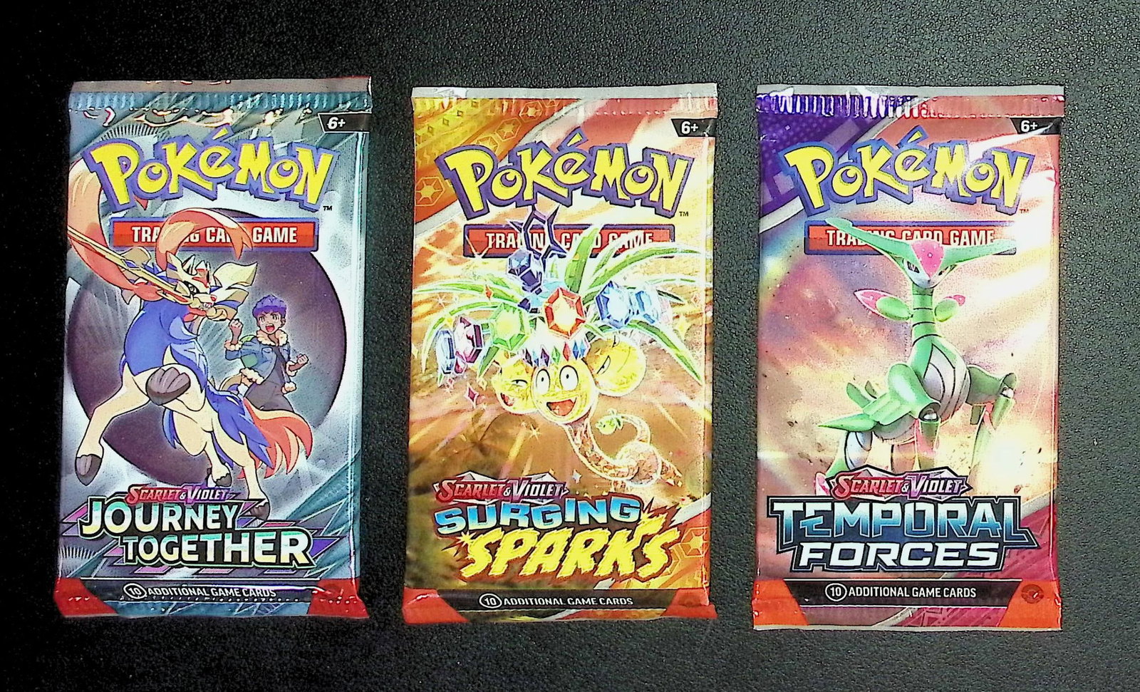 3 COUNT: 1 - Pokemon Temporal Forces, 1 -Surging Sparks, & 1 - Journey Together Booster Packs: Pokemon Trading Card Game Cards, Charizard, Pikachu, Mewto, EX, Referse Holo, Holo Rare Cards, Secret Rare Cards, Full Art Cards, Evee, 3 Stars Ultra Rare Cards, Double Rare, Illustration Rare, Specia