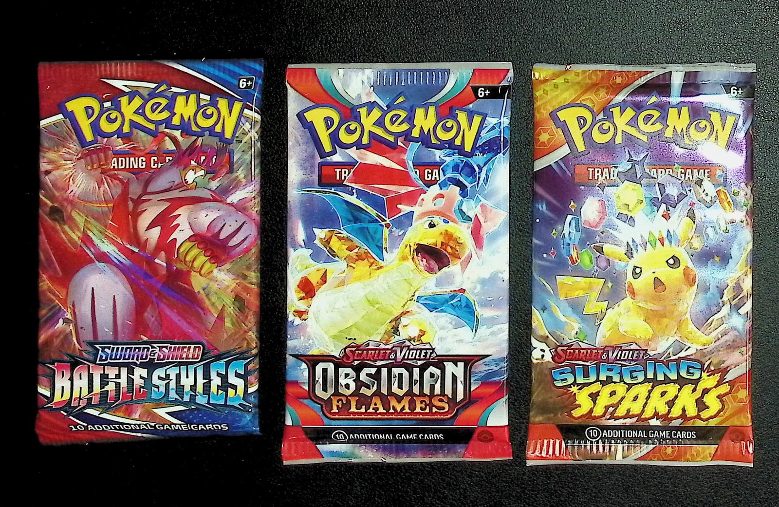 3 COUNT: 1 - Pokemon Battle Styles, 1 - Obsidian Flames, & 1 - Surging Sparks Booster Packs: Pokemon Trading Card Game Cards, Charizard, Pikachu, Mewto, EX, Referse Holo, Holo Rare Cards, Secret Rare Cards, Full Art Cards, Evee, 3 Stars Ultra Rare Cards, Double Rare, Illustration Rare, Specia