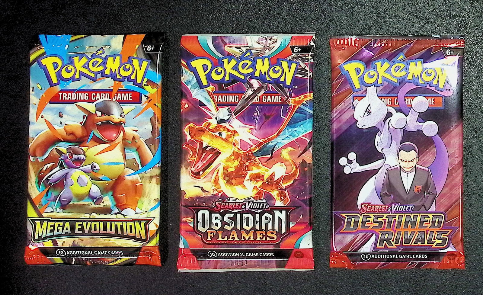 3 COUNT: 1 - Pokemon Destined Rivals, 1 - Mega Evolution, & 1 - Obsidian Flames Booster Packs: Pokemon Trading Card Game Cards, Charizard, Pikachu, Mewto, EX, Referse Holo, Holo Rare Cards, Secret Rare Cards, Full Art Cards, Evee, 3 Stars Ultra Rare Cards, Double Rare, Illustration Rare, Specia