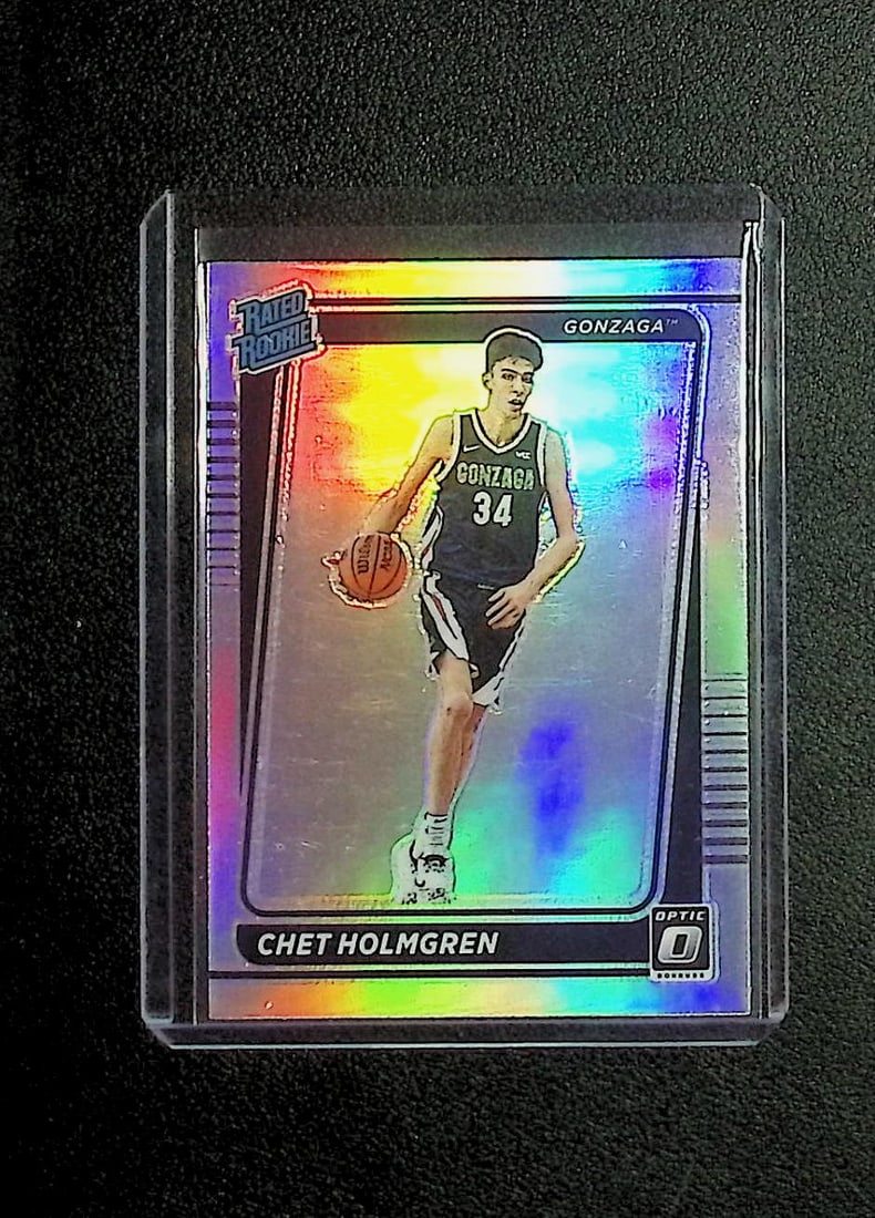 Chet Holmgren Rookie Card Holo Prizm 2022 Chornicles Donruss Optic Draft Picks #1: Panini Select, Prizm, Mosaic, Contenders, Revolution, Phoenix, NBA Hoops, Rookie NFL Sports Trading Cards, Silver, SP, SSP, Wave Prizms, Numbered Cards, Basketball sports Cards for Sale Near Me, NBA C