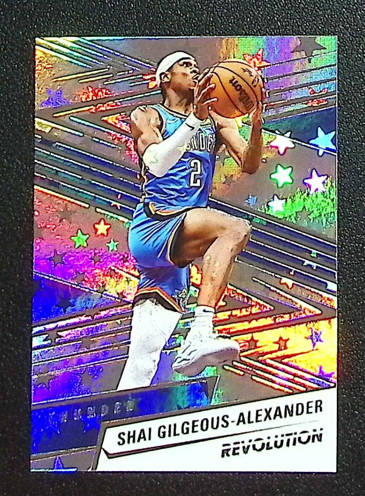 Shai Gilgeous-Alexander Astro 2024-25 Panini Revolution #8 OKC Thunder: Panini Select, Prizm, Mosaic, Contenders, Revolution, Phoenix, NBA Hoops, Rookie NFL Sports Trading Cards, Silver, SP, SSP, Wave Prizms, Numbered Cards, Basketball sports Cards for Sale Near Me, NBA C