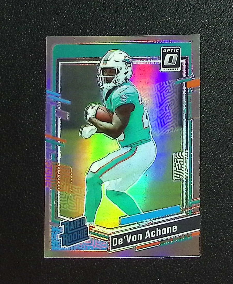 De'Von Achane Rookie Card Holo Prizm 2023 Donruss Optic #269 Miami Dolphins: Panini, Donruss Optic, & Donruss Select, Prizm, Mosaic, Contenders, Zenith, Phoenix, Illusions, Absolute, Rookie NFL Sports Trading Cards, SP, SSP, Cards, Football Cards for Sale Near Me, Superbowl & 