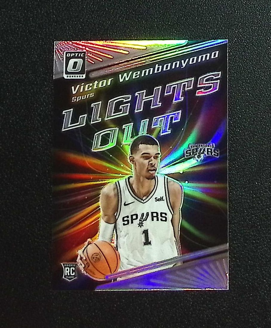 Victor Wembanyama Rookie Card Lights Out Holo Prizm 2023-24 Donruss Optic #4: Panini, Donruss Optic, Donruss Select, Prizm, Mosaic, Contenders, Revolution, Phoenix, NBA Hoops, Rookie NFL Sports Trading Cards, Silver, SP, SSP, Wave Prizms, Numbered Cards, Basketball sports Cards