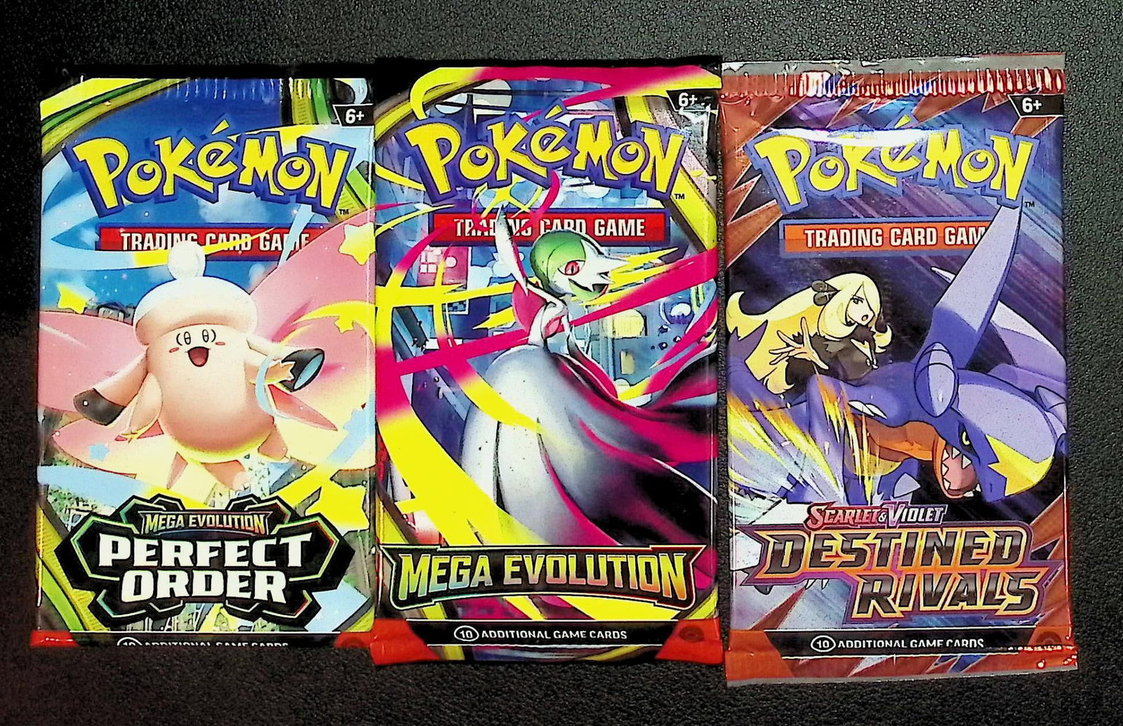 3 COUNT: 1 - Pokemon Destined Rivals, 1 - Mega Evolution, & 1 - Perfect Order Booster Packs: Pokemon Trading Card Game Cards, Charizard, Pikachu, Mewto, EX, Referse Holo, Holo Rare Cards, Secret Rare Cards, Full Art Cards, Evee, 3 Stars Ultra Rare Cards, Double Rare, Illustration Rare, Specia