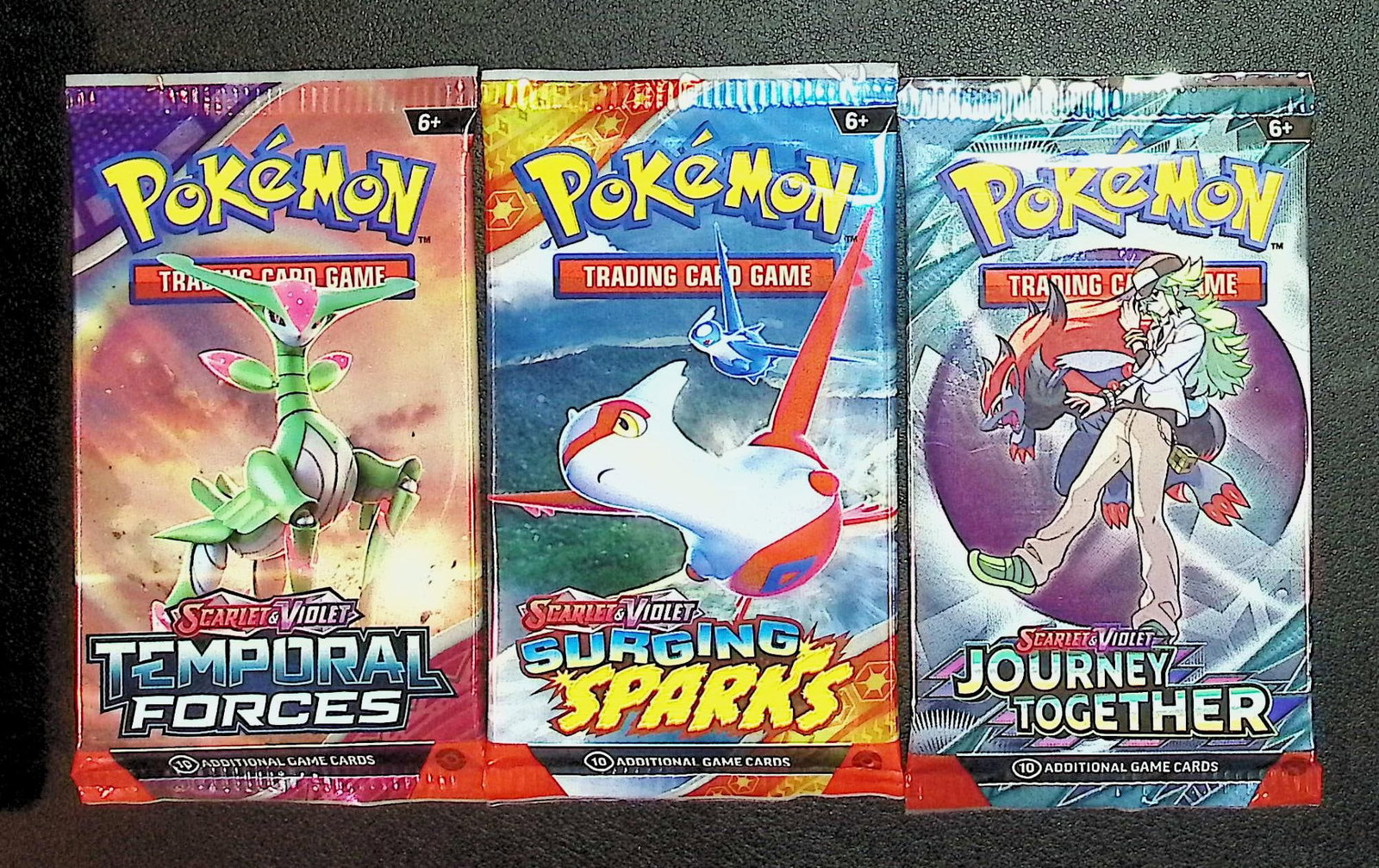 3 COUNT: 1 - Pokemon Temporal Forces, 1 -Surging Sparks, & 1 - Journey Together Booster Packs: Pokemon Trading Card Game Cards, Charizard, Pikachu, Mewto, EX, Referse Holo, Holo Rare Cards, Secret Rare Cards, Full Art Cards, Evee, 3 Stars Ultra Rare Cards, Double Rare, Illustration Rare, Specia