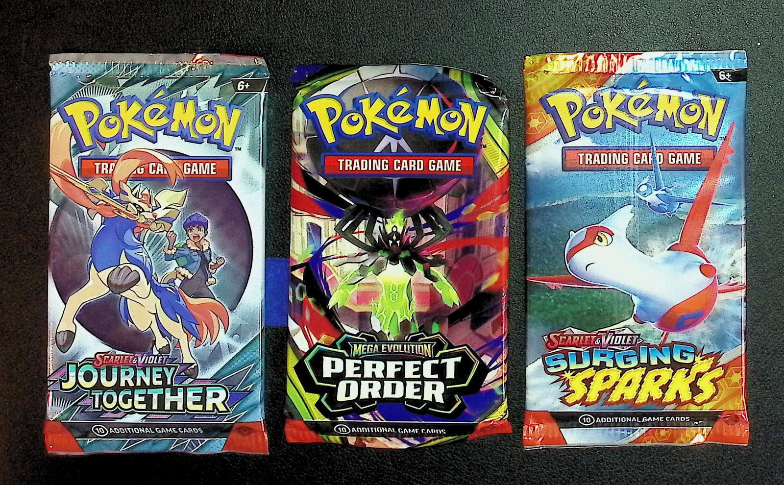3 COUNT: 1 - Pokemon Journey Together, 1 - Perfect Order, & 1 - Surging Sparks Booster Packs: Pokemon Trading Card Game Cards, Charizard, Pikachu, Mewto, EX, Referse Holo, Holo Rare Cards, Secret Rare Cards, Full Art Cards, Evee, 3 Stars Ultra Rare Cards, Double Rare, Illustration Rare, Specia