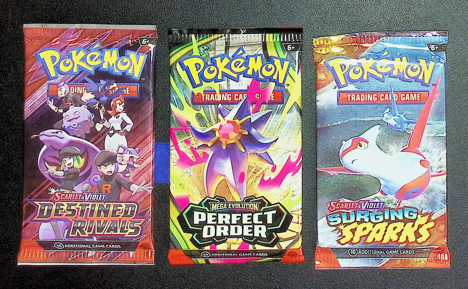 3 COUNT: 1 - Pokemon Destined Rivals, 1 - Perfect Order, & 1 - Surging Sparks Booster Packs: Pokemon Trading Card Game Cards, Charizard, Pikachu, Mewto, EX, Referse Holo, Holo Rare Cards, Secret Rare Cards, Full Art Cards, Evee, 3 Stars Ultra Rare Cards, Double Rare, Illustration Rare, Specia
