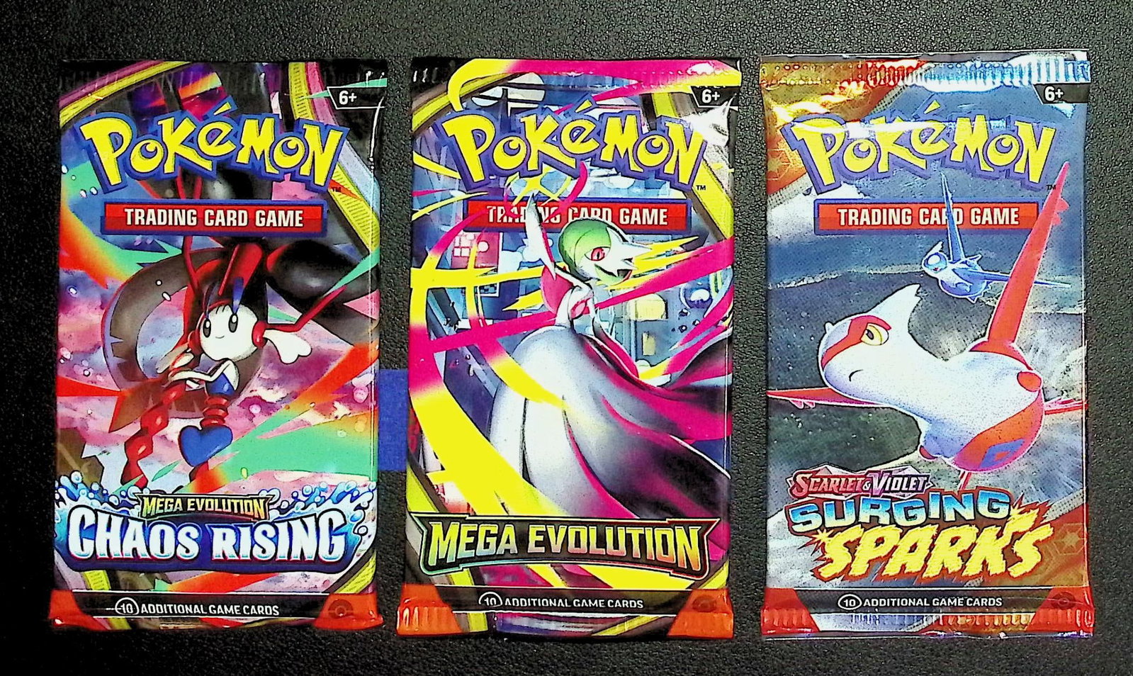 3 COUNT: 1 - Pokemon Chaos Rising, 1 - Mega Evolution, & 1 - Surging Sparks Booster Packs (1 of 1)