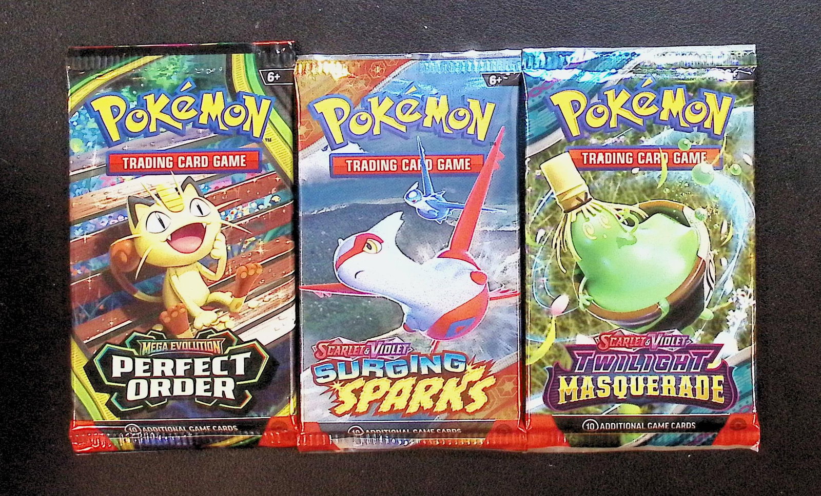 3 COUNT: 1 - Pokemon Perfect Order, 1 - Surging Sparks, & 1 - Twilight Masquerade Booster Packs: Pokemon Trading Card Game Cards, Charizard, Pikachu, Mewto, EX, Referse Holo, Holo Rare Cards, Secret Rare Cards, Full Art Cards, Evee, 3 Stars Ultra Rare Cards, Double Rare, Illustration Rare, Specia