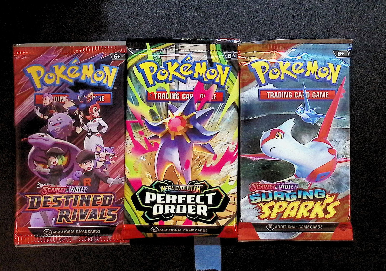 3 COUNT: 1 - Pokemon Destined Rivals, 1 - Perfect Order, & 1 - Surging Sparks Booster Packs: Pokemon Trading Card Game Cards, Charizard, Pikachu, Mewto, EX, Referse Holo, Holo Rare Cards, Secret Rare Cards, Full Art Cards, Evee, 3 Stars Ultra Rare Cards, Double Rare, Illustration Rare, Specia